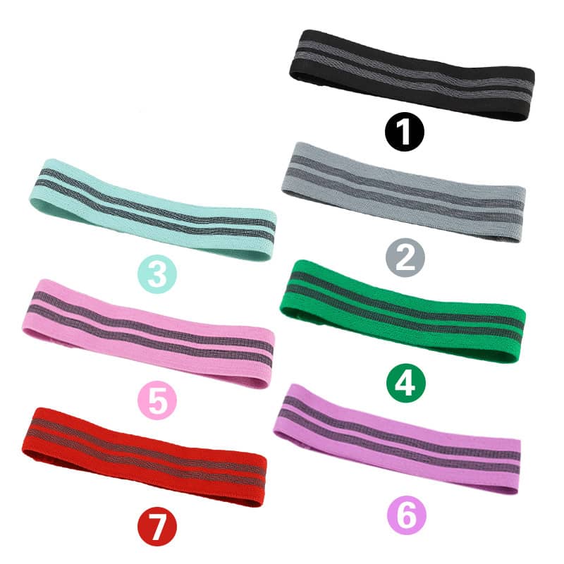 Set of colorful resistance bands with striped design on a white background