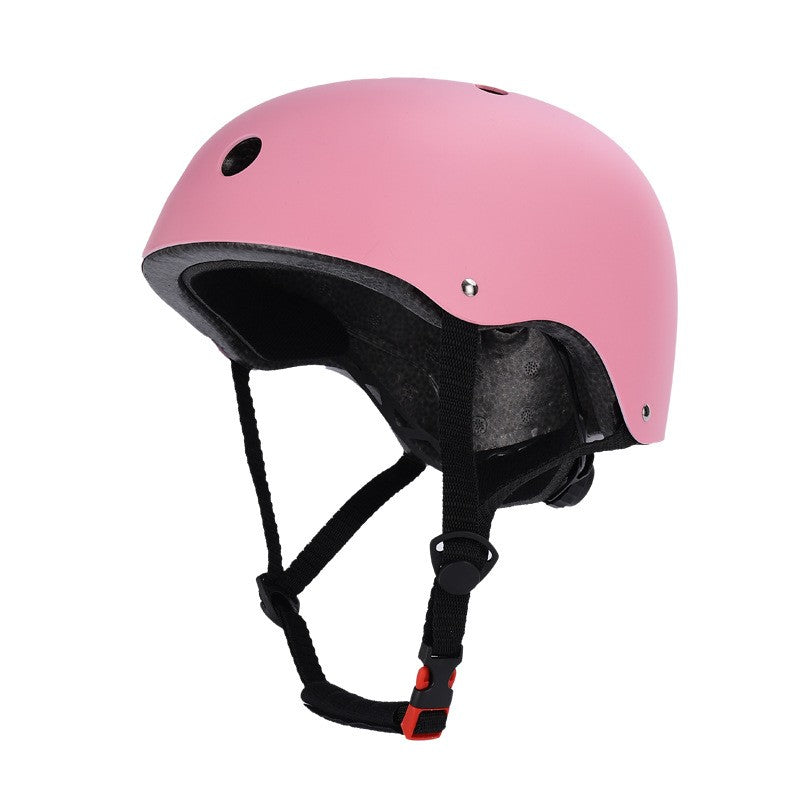 Pink helmet with black straps on a white background