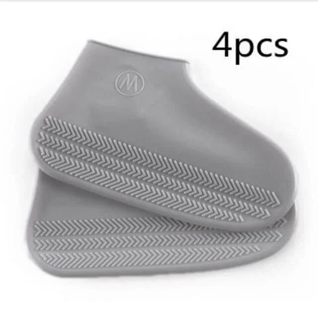 Gray silicone shoe covers with a brand logo on a white background