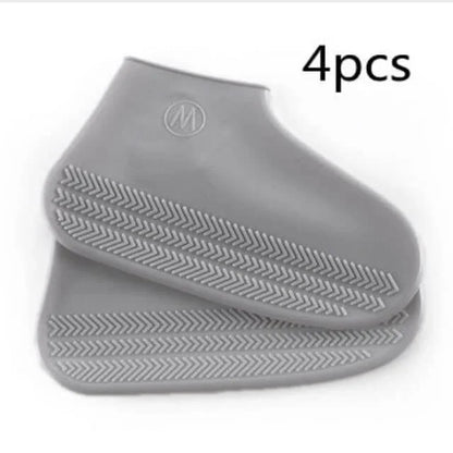 Gray silicone shoe covers with a brand logo on a white background