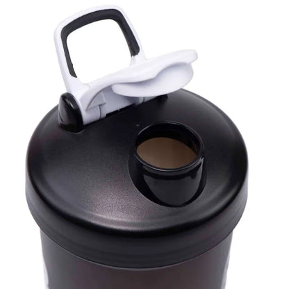 Black shaker bottle with a white lid on a white background