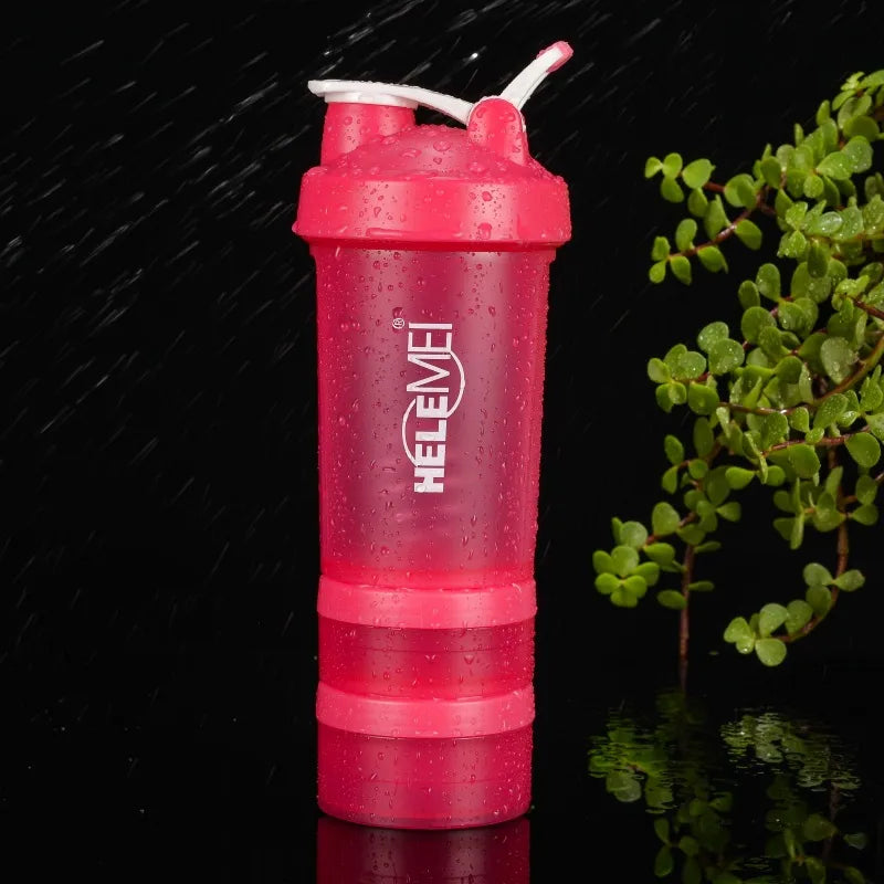 Pink HELEME shaker bottle with a plant in the background