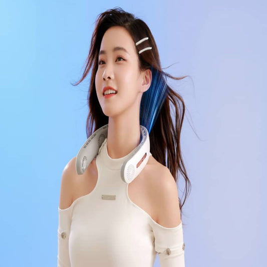 Woman wearing a white shoulder brace against a light blue background