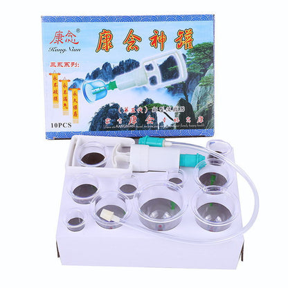 White electronic device with transparent lid, containing small round containers, in front of a colorful box with text and images.