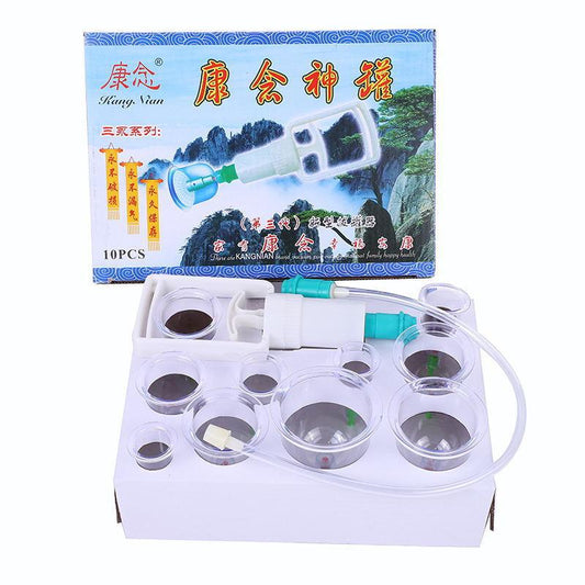 White electronic device with transparent lid, containing small round containers, in front of a colorful box with text and images.