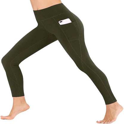 Woman wearing olive green high-waisted workout leggings with side pocket holding a smartphone