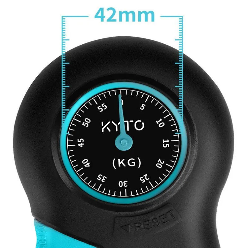 Close-up of a KYTO hand-held scale showing a black dial with a turquoise ring and measurement overlay indicating 42mm.