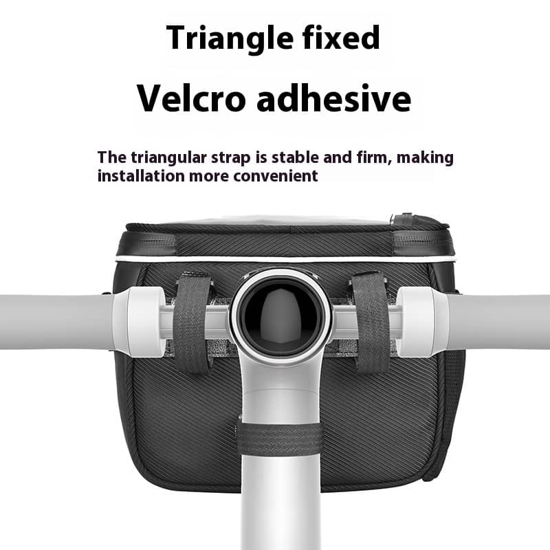 Black handlebar bag with triangular strap and velcro adhesive on a white background