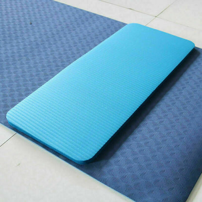 Blue exercise mat on a tiled floor