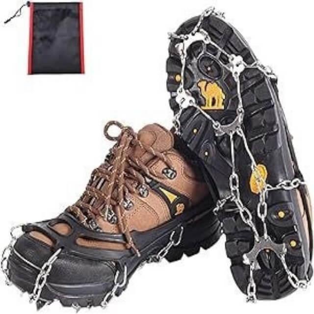 Hiking boots with ice traction cleats for outdoor winter walking, with storage bag