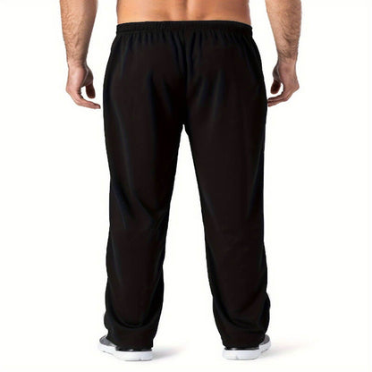 Black pants worn by a person on a white background