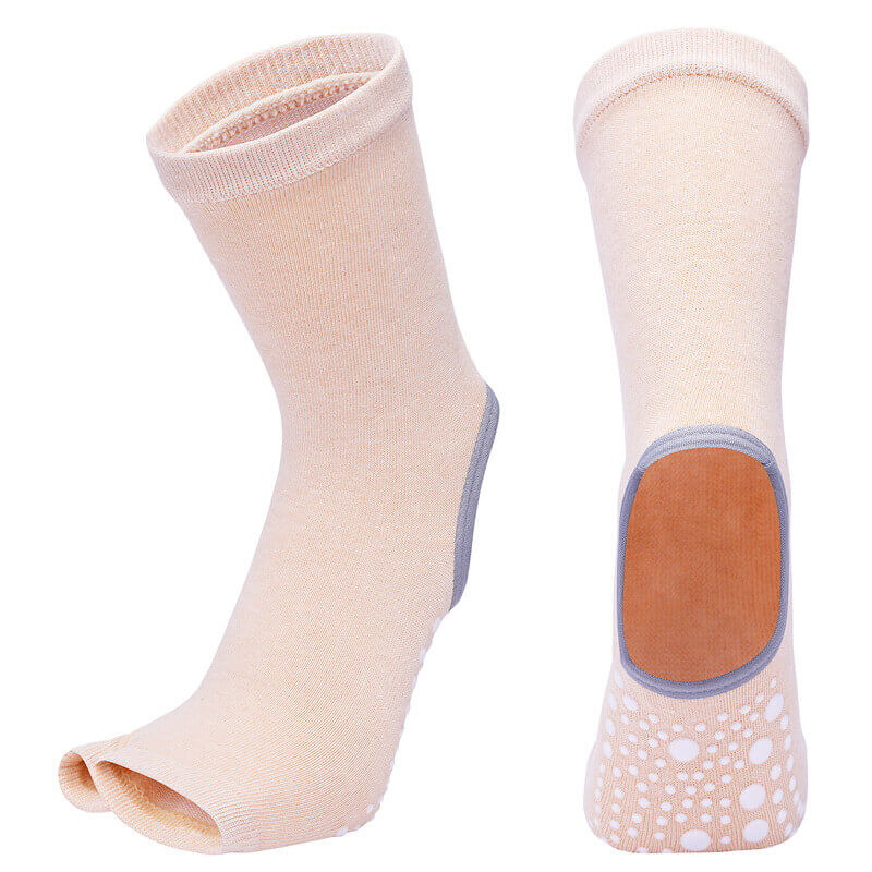 Pair of beige ankle socks with a brown heel patch on a white background