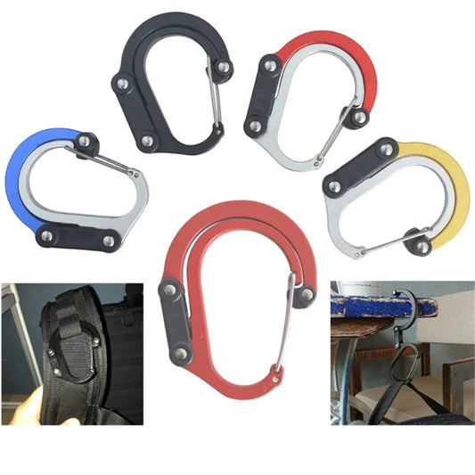Assorted color heavy-duty carabiner clips shown attached to backpack and gym equipment