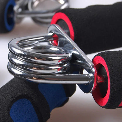 Close-up of metal hand grip strengthener with black and red foam handles for fitness training