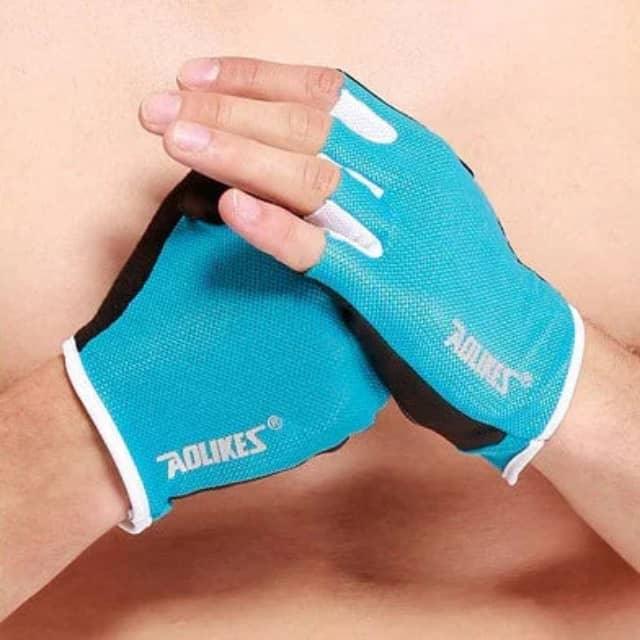 Man wearing blue breathable fitness gloves for workout or weightlifting