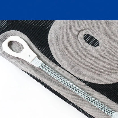 Close-up of a fitness resistance band with metal spring and plastic handle on a textured mat