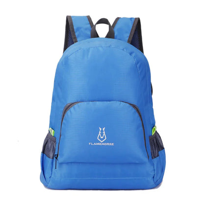 Blue lightweight backpack with front pocket and mesh side pockets for outdoor activities.