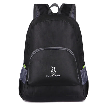 Black lightweight backpack with front zipper pocket and side mesh pockets, outdoor gear