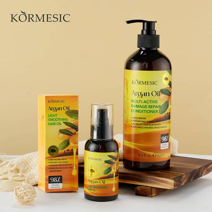 Kormesic Argan Oil hair care products on a wooden tray with a beige background