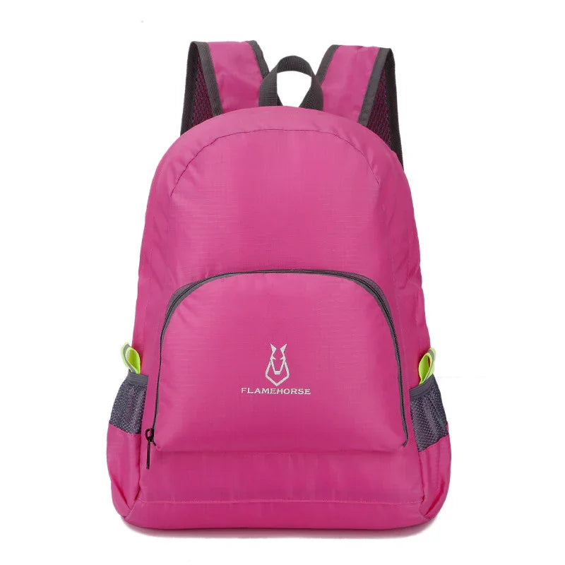 Pink outdoor backpack with mesh side pockets and Flamehorse logo, lightweight travel gear
