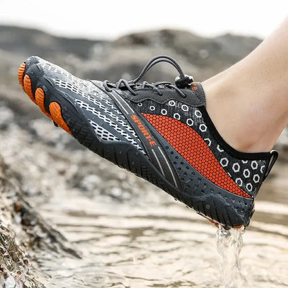 Lightweight water shoe with orange and black mesh, ideal for outdoor fitness activities