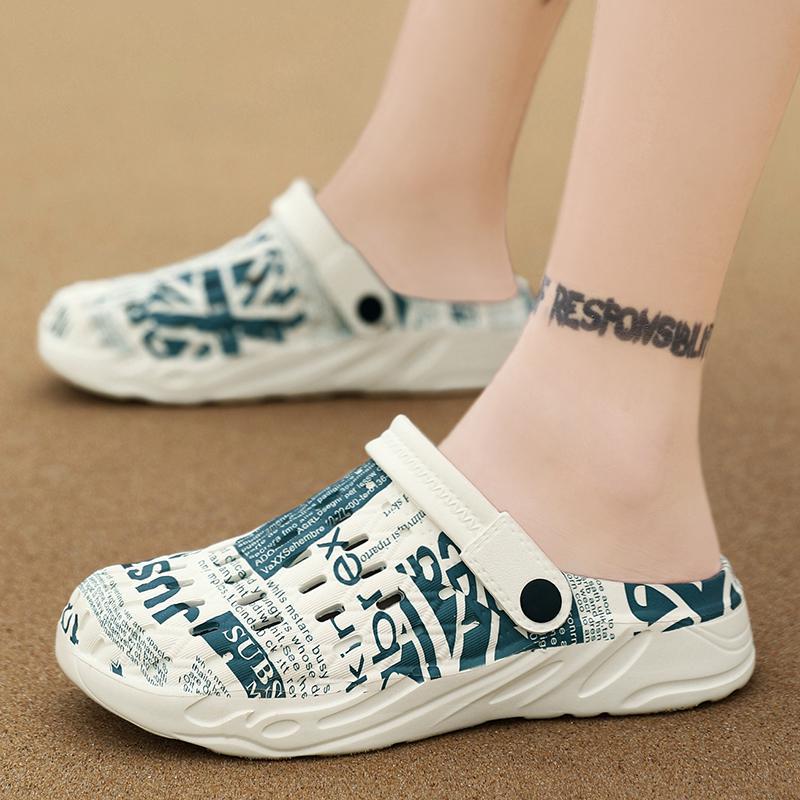 White clogs with blue text on a brown background