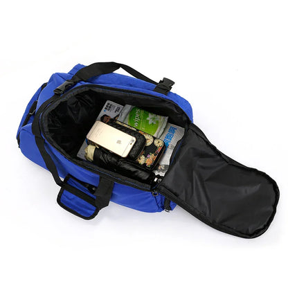Open blue gym bag with phone, wipes, umbrella and essentials inside on white background