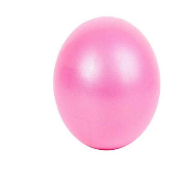 Pink exercise ball on a white background