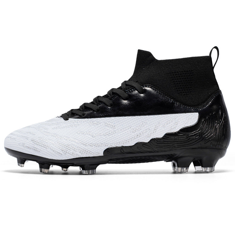 Black and white soccer cleat on a white background