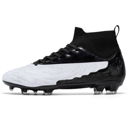 Black and white soccer cleat on a white background