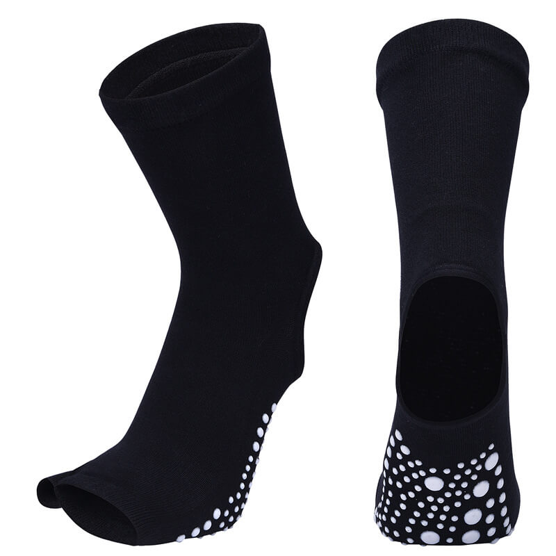 Black socks with white dot patterns on a white background