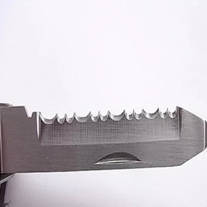 Close-up of a serrated stainless steel multi-tool blade on white background
