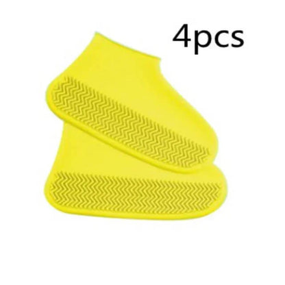 Four yellow silicone shoe covers on a white background with '4 pcs' text.