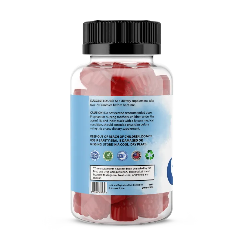 A clear plastic bottle of gummies with a black ribbed cap and a blue-and-white label showing the back side. The bottle is filled with pink gummies and contains a small red insert card.