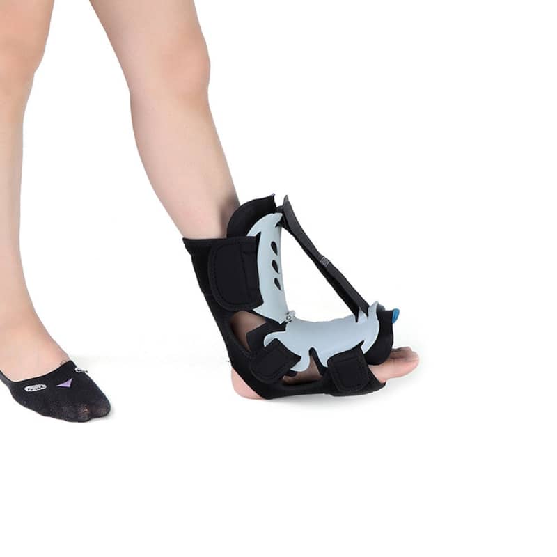 Person wearing an adjustable foot brace for plantar fasciitis or ankle support