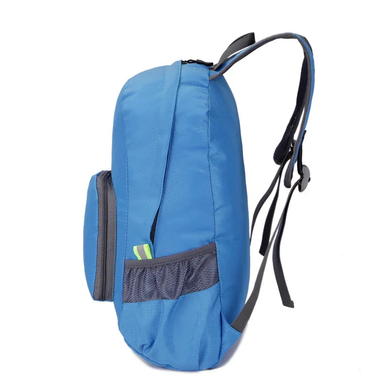 Blue fitness backpack with black straps, mesh side pocket, and front zip pocket