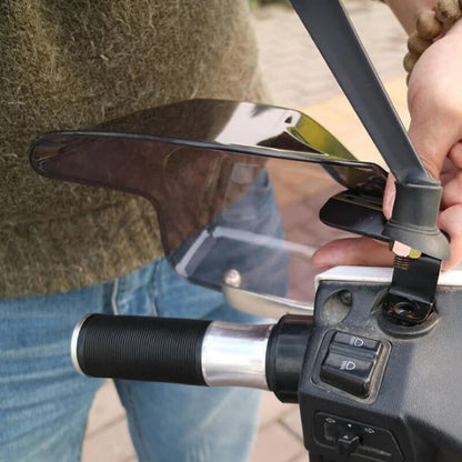 Installing motorcycle handguard on handlebar with control switches visible