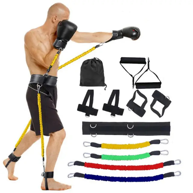Man using resistance bands with various resistance band components on a white background