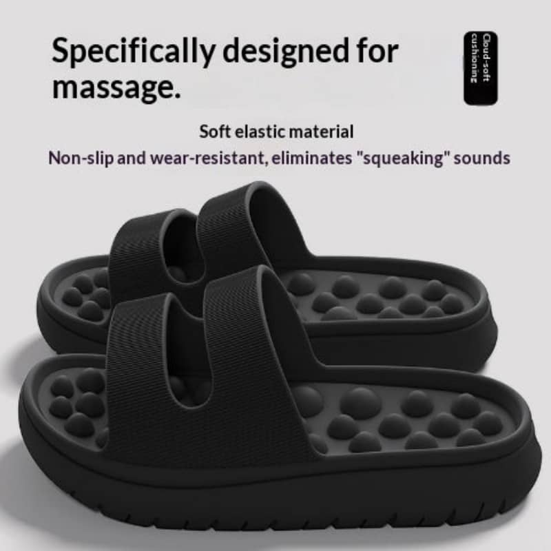 Black massage sandals with soft elastic material on a white background