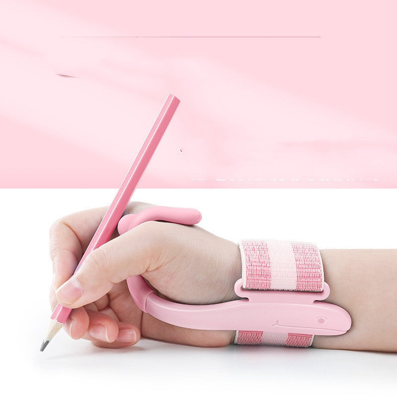 Hand with pink writing aid device holding a pencil on a white background