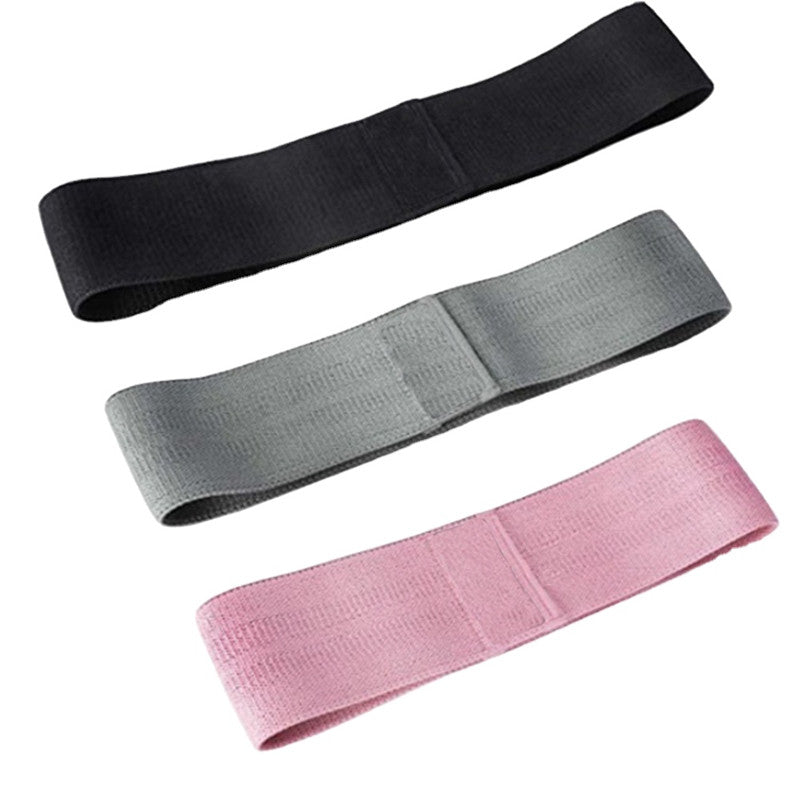 Three resistance bands in black, gray, and pink on a white background