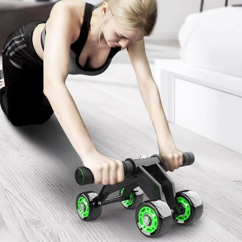 Person using a black and green exercise roller on a light wooden floor.