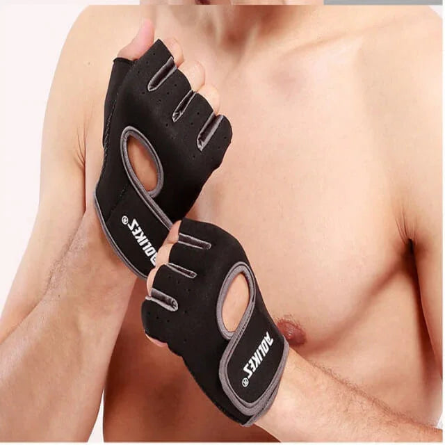 Black workout gloves with brand logo held by a person on a plain background