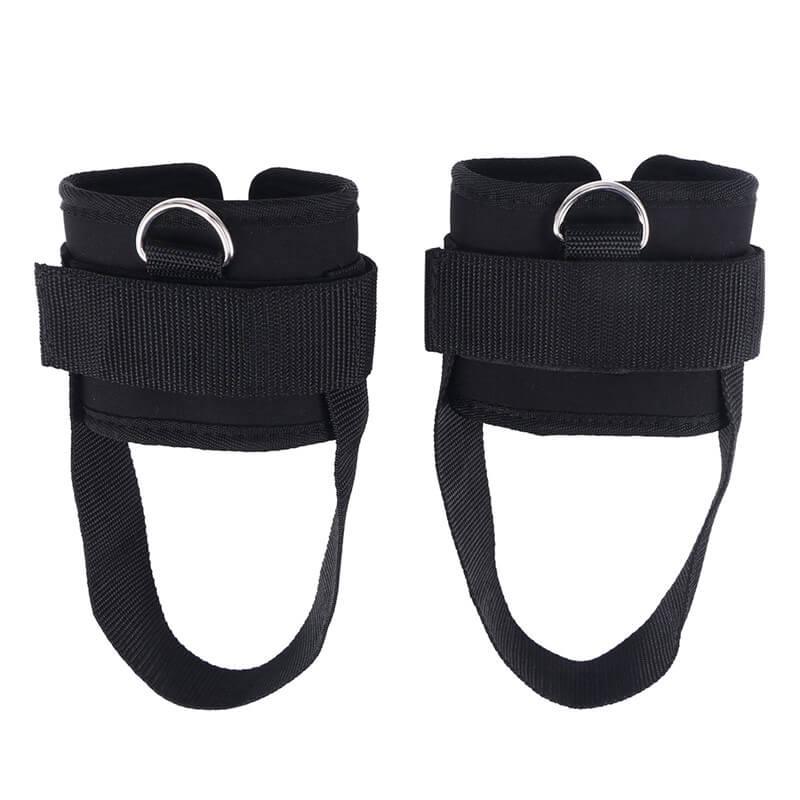 Pair of black ankle straps with D-rings on a white background