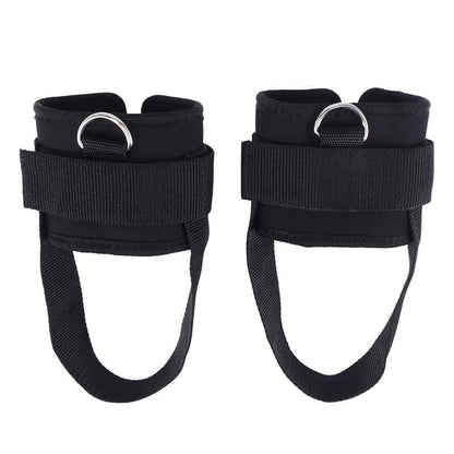 Pair of black ankle straps with D-rings on a white background