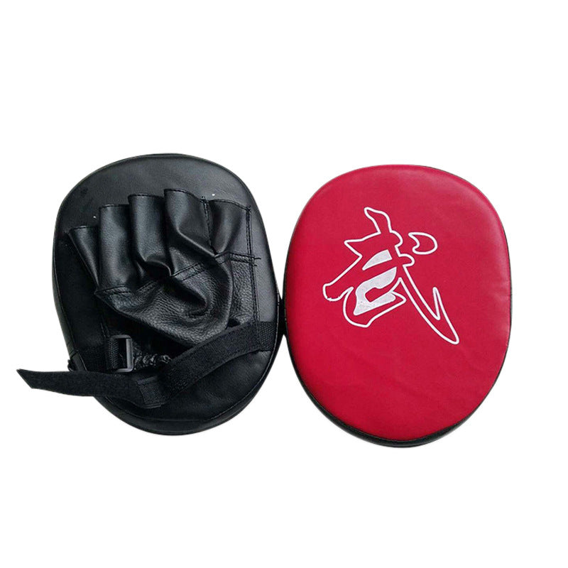 Black and red martial arts training pads with a white symbol on a white background