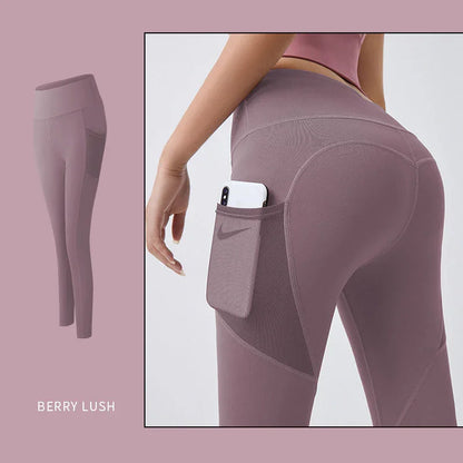 Purple leggings with a pocket holding a phone, on a light pink background.