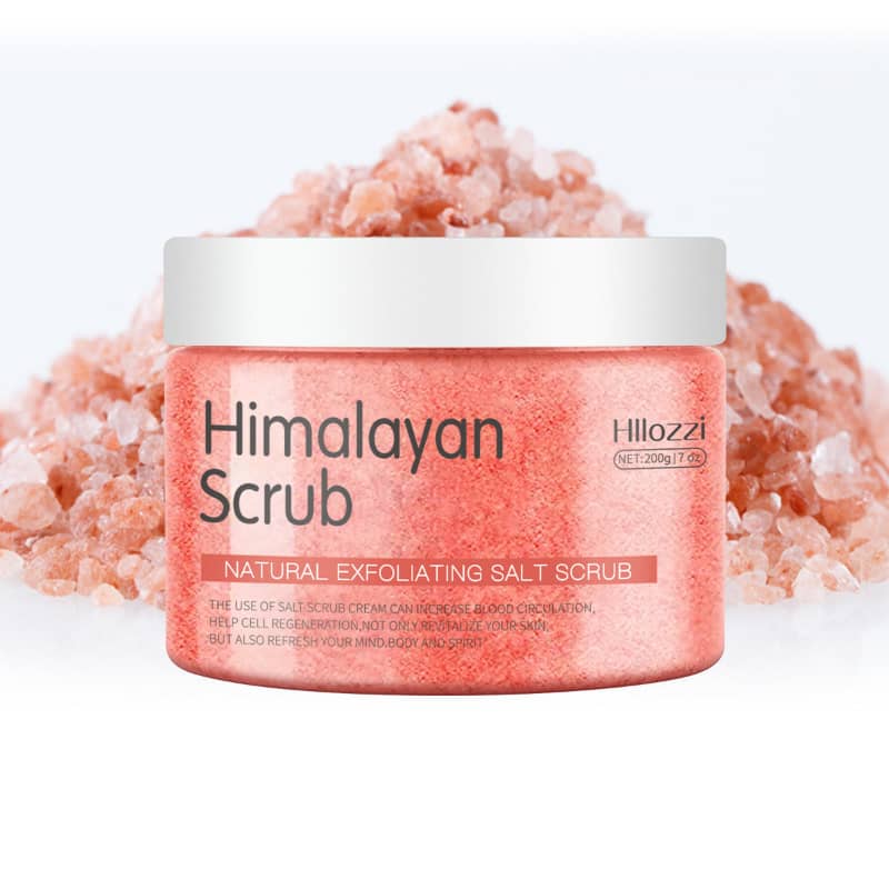 Himalayan scrub jar with pink salt on a white background