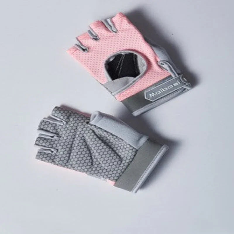 Pair of pink and gray gloves on a light gray background