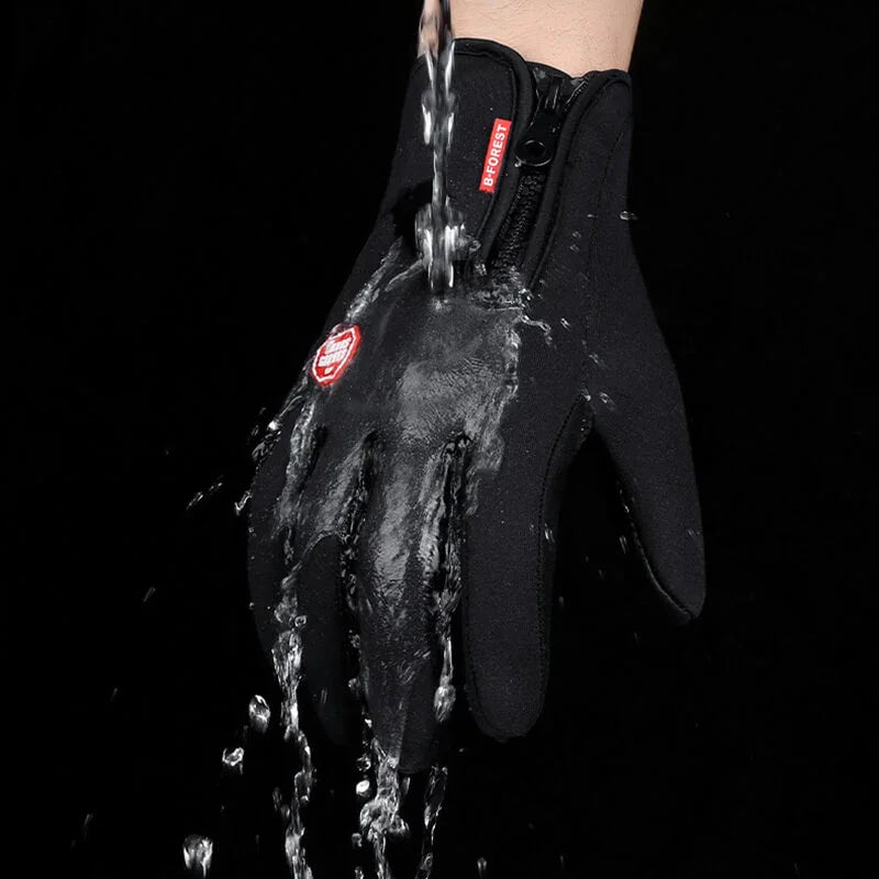 Waterproof black outdoor glove shown with water pouring over it on a black background